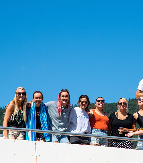 A picutre our staff enjoying a warm summer day on the top deck of a houseboat.