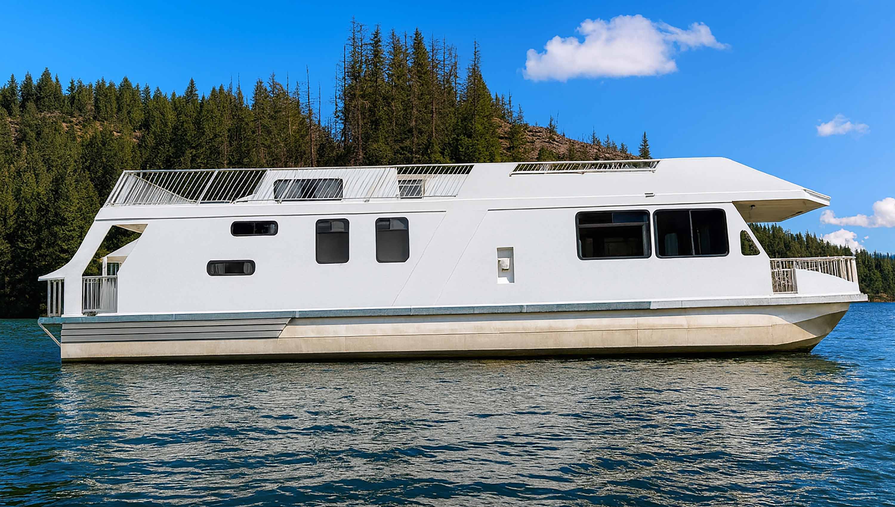 The CruiseCraft sailing on Shuswap lake on a calm, sunny day.