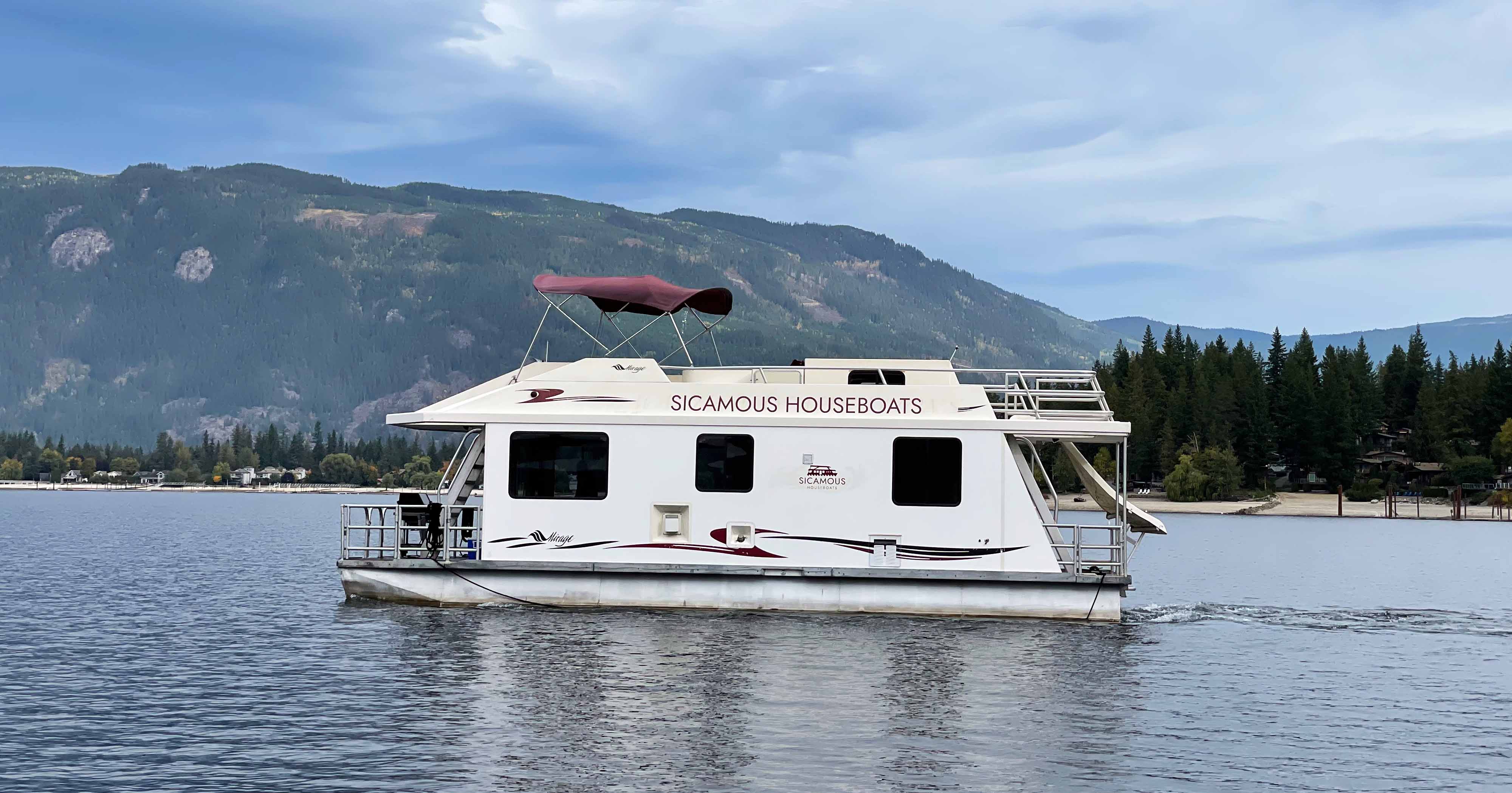 The Mirage 40 moored on a beach on Shuswap lake in the afternoon.