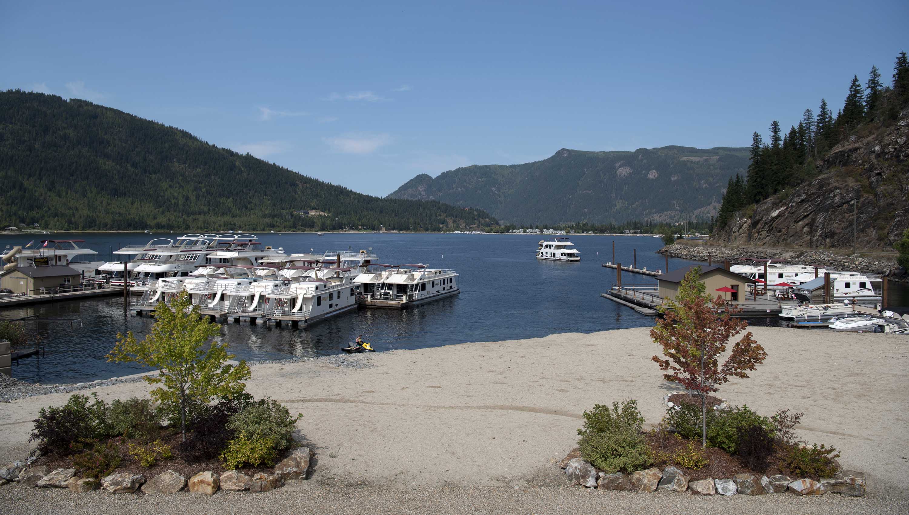 Sicamous Houseboats marine with houseboats docked at the marine.