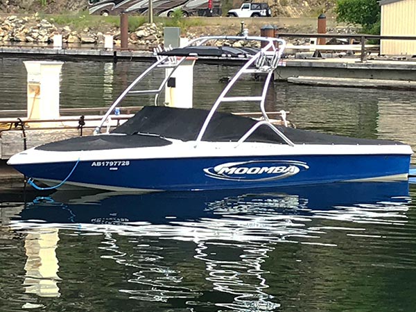 The Moomba Mobius boat docked in the water.